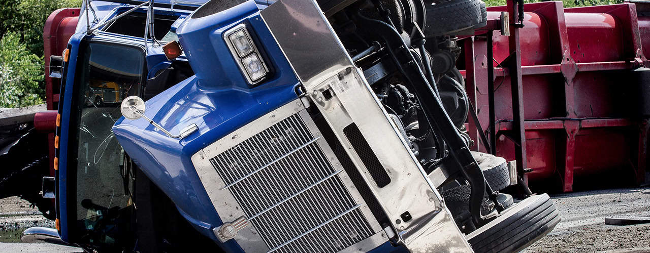 Truck accident with a rolled over tractor trailer